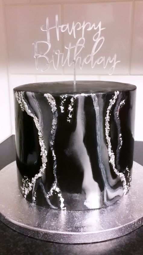 Black and white marble fondant cake with specs of edible silver leaf. Simple but elegant #blackcake #blackandsilvercake #marblefondant @calizaskitchencakes Black White And Silver Cake Ideas, Black White And Silver Birthday Theme, Birthday Cake Black And Silver, Black And White Cake Aesthetic, Black 21st Birthday Cake, Black And Silver Cakes Birthday, Black And Silver Birthday Theme, Black And Silver Birthday Cake, Black Theme Cake