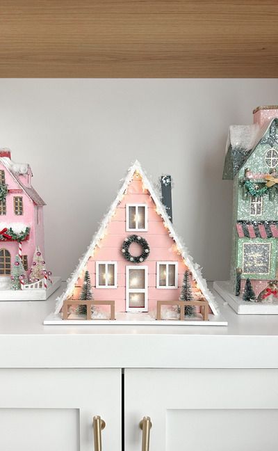 Christmas House Painting Craft, Christmas House Painting Ideas, Diy Painted Christmas Village Houses, Pink Gingerbread Houses, Mini Christmas Houses Diy, Painted Christmas Houses Diy, Painting Christmas Village Houses, Painted Christmas Houses, Diy Whimsical Christmas Decor