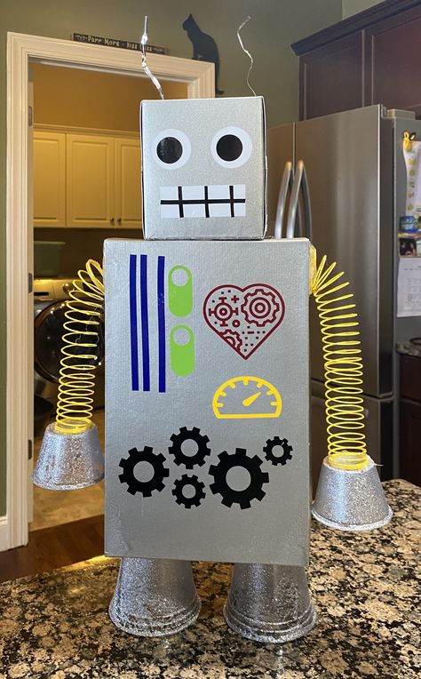 Make Robot Out Of Boxes, Robot Made From Boxes, Diy Robot Decorations, Robot Valentines Boxes, Back To The Future Crafts, Robot Diy Recycle, How To Make A Robot Out Of Recyclables, 3d Shape Robot Project, Recycle Robot Project Ideas