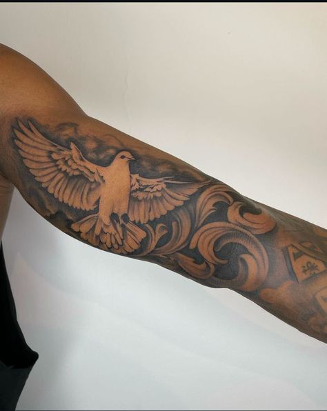 Dove Bicep Tattoo Men, Inner Bicep Bird Tattoo, Upper Bicep Tattoos For Men, Shoulder Tattoo Black Men, Tattoo Black Men, Outer Bicep Tattoo Men, Inner Bicep Tattoo Men, Outer Bicep Tattoos, Shoulder Piece Tattoo