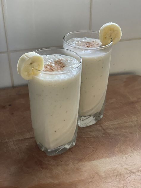 This is the easiest, healthiest, ultimate banana milkshake recipe that will become your go-to whether you are craving a refreshing drink, need a mid-day energy booster, or looking for a quick and tasty post workout meal (in which case I recommend you add 1 scoop of protein powder to the recipe below).It requires only 2 ingredients (optionally a few more toppings such as spices (cinnamon / nutmeg) or coconut flakes or even more banana chunks to make it look / feel like a vacation drink… Banana Milkshake Recipe, Post Workout Meal, Milkshake Recipe, Energy Booster, Banana Milkshake, Milkshake Recipes, Post Workout Food, Cinnamon Banana, Smoothie Ingredients