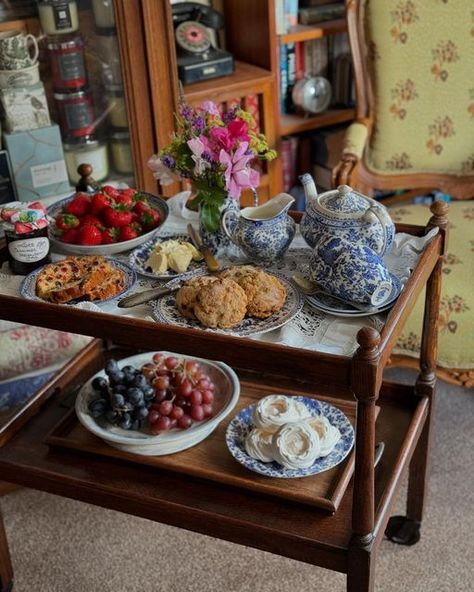 Karen S Burns on Instagram: "A very special Sunday Tea Tray today…..the first Sunday in July.  I’m sharing TWO tea trays! And one is actually my new old tea trolley…..  …..we had a ploughman’s lunch tea tray today - dodging the rain outside where we were gardening.   Then this afternoon, we have our tea tray dessert, on Susie tea trolley, so, a two part Sunday tea tray today - savoury & sweet.   On the tea tray and tea trolley we have:   SAVOURY: Granary bread rolls  Irish salted butter  Homemade chutney  Homemade pickled onions  Gherkins  Celery  Local tomatoes  Smoked ham  Wensleydale Blue cheese Red Leicester cheese  Cote Hill Snowdrop cheese  English apples   SWEET:  English strawberries  Pouring cream  Meringues  Five O’Clock Tea Cakes  Homemade strawberry jam  Sweet butter  1950’s St Afternoon Tea Set Up, Tea Tray Ideas, Tea Trolley Ideas, Trolley Aesthetic, Homemade Chutney, Red Leicester Cheese, Sunday Tea, Christmas Afternoon Tea, Butter Homemade