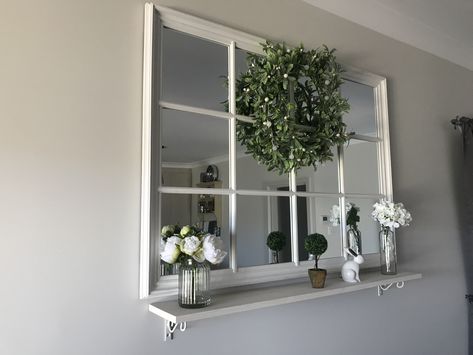 Added a shelf under window pane mirror White Window Mirror, Shelf Under Mirror Living Room, Daybed Under Window, Mirror Window Wall Decor, Shelf Under Window, Shelf Under Mirror, Daybed In Living Room, Window Pane Art, Housing Interior