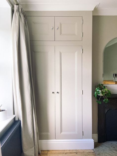 We had a large alcove in the bedroom at No. 8, which was crying out to be used for some built in storage. My husband Will built this Victorian-style wardrobe by framing out the alcove, and building the shell from MDF. We painted it in Farrow & Ball Elephants Breath Estate Eggshell, and i'm sure you'll agree it looks beautiful! It was so useful for storage, and completely transformed the room. Coloured Built In Wardrobe, Built In Wardrobe Ideas Victorian House, Built In Storage Cupboard, Alcove Cupboards Bedroom, Wardrobes In Alcoves, Wardrobe Alcove, Built In Wardrobe Ideas Alcove, Office Bedroom Combo, Alcove Wardrobe