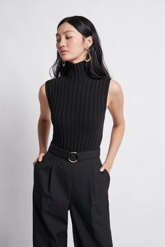 Sleeveless Black Turtleneck Outfit, Sleeveless Turtleneck Women, Turtleneck Jacket Outfit, Styling Turtle Neck Tops, Sleeveless Turtleneck Aesthetic, Turtle Neck Sleeveless Outfit, Turtleneck Sleeveless Outfit, Black Sleeveless Top Outfit, Sleeveless Shirt Outfit