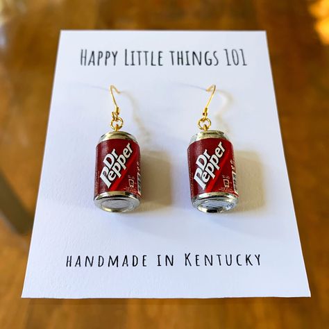 It's a must-have item for a classic soda lover!! It's a fun gift for your friend, loved one or yourself. We use quality 18K gold plated stainless. All the earrings are nickel free & safe for sensitive skin. Have fun!! These famous icon will make everyone smile❤️ Now each item comes in a small individual box. It will be ready as a gift❤️ Thank you for the taking the time out to look at our earrings. Please visit our shop for more original designs: https://www.etsy.com/shop/HappyLittleThings101 ---------------------------------------------------------- **Now we also sell Personalized Gift Mugs❤️ Please click on the link below: https://www.etsy.com/listing/1670692166/thank-you-for-going-the-extra-mile?click_key=04c4a6f46f3a59bf97b7faa6298707eee266184c%3A1670692166&click_sum=76c55f4b&ref=shop_ Fun Jewelry Aesthetic, Unique Earrings Weird, Weird Earrings Aesthetic, Fun Earrings Unique, Silly Earrings, Lesbian Earrings, Crazy Earrings, Weird Earrings, Funny Jewelry