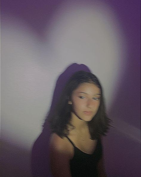 Girl with heart shaped light on her looking away from the camera. The lighting aside from the flashlight is purple Flash Pictures Aesthetic At Home, Flashlight Photo Ideas, Insta Photo Ideas Blurry, Blurry Flash Aesthetic, Aesthetic Flash Photos, Flash Photography Aesthetic Night, Flashlight Photoshoot, Night Photoshoot With Flash, Flash Pictures Aesthetic