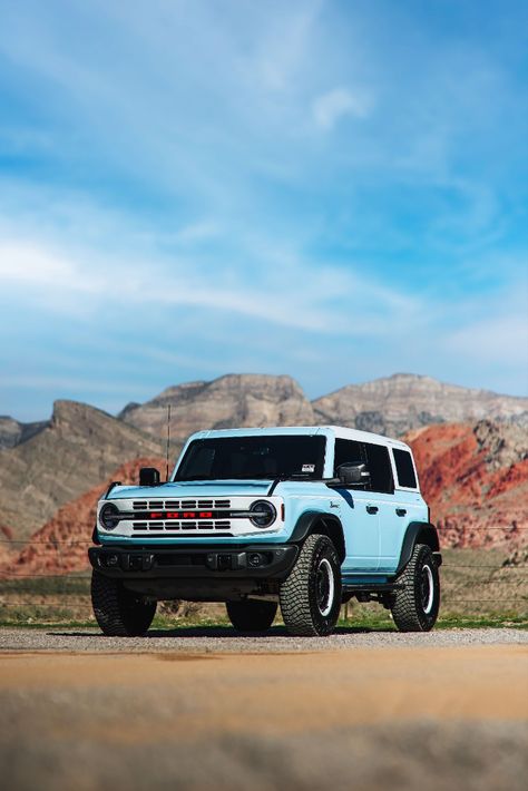 2023 Ford Bronco Heritage Edition in Robins Egg Blue Parked On A Dirt Road During The Day With Red Rock Mountains In The Background. Blue Ford Bronco Aesthetic, Blue Bronco Aesthetic, Outer Banks Bronco, Bronco Ford 2023, Ford Bronco Heritage Edition, Light Blue Bronco, Baby Blue Bronco, Ford Bronco 2023, Ford Bronco Aesthetic