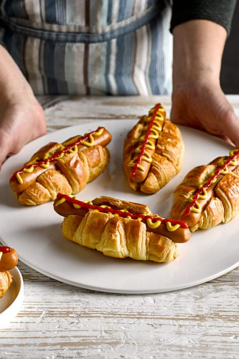 A plate with croissants filled with hot dogs and topped with ketchup and mustard. Croissant Hot Dogs, Hot Dog Croissant, French Hot Dog, Hot Dog Recipe, Making Hot Dogs, Hot Dog Rolls, Mini Hot Dogs, French Croissant, French Dog