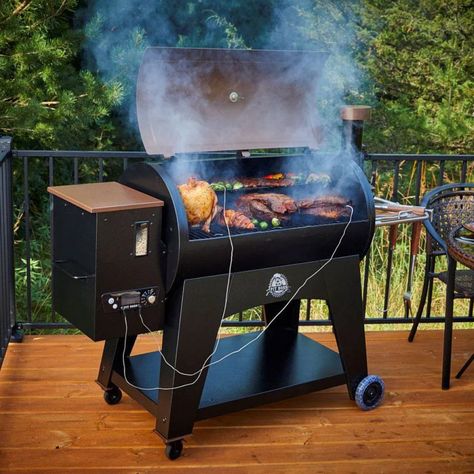 Pit Austin XL 1000sq in Wood Fired Pellet Grill and Smoker 𝐄𝐱𝐩𝐞𝐫𝐢𝐞𝐧𝐜𝐞 𝐭𝐡𝐞 𝐔𝐥𝐭𝐢𝐦𝐚𝐭𝐞 𝐎𝐮𝐭𝐝𝐨𝐨𝐫 𝐂𝐨𝐨𝐤𝐢𝐧𝐠 𝐰𝐢𝐭𝐡 𝐎𝐮𝐫 𝐖𝐨𝐨𝐝 𝐅𝐢𝐫𝐞𝐝 𝐏𝐞𝐥𝐥𝐞𝐭 𝐆𝐫𝐢𝐥𝐥 𝐚𝐧𝐝 𝐒𝐦𝐨𝐤𝐞𝐫 Transform your backyard into a gourmet kitchen with our Wood Fired Pellet Grill and Smoker. This state-of-the-art cooking machine is the perfect blend of functionality and style, designed to cater to all your grilling and smoking needs. With over 1,000 square inches of cooking space, it’s the ideal solution for gatherings large and small, from family ... Pit Boss Pellet Grill, Wood Smokers, Pellet Grills Smokers, Fire Pots, Pellet Grill Recipes, Wood Pellet Grills, Put Things Into Perspective, Cooking Temperatures, Wood Pellets