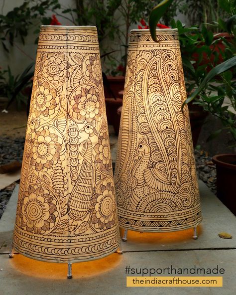 This beautifully crafted set of hand painted lamp shades are a lovely home accent, to add that extra touch of class to your decor. The translucent leather painting art form from Andhra Pradesh was originally used to make puppets for the popular shadow-puppet theatre tradition of Andhra Pradesh -‘Tholu Bommalata’- literally meaning ��“the dance of leather dolls Tholu Bommalata Designs, Lamp Shade Diy Ideas, Lamp Painting Ideas, Lamp Shade Painting, Hand Painted Lamp Shades, Indian Lighting, Leather Lamps, Creative Lamps Diy, Painted Lamp Shades