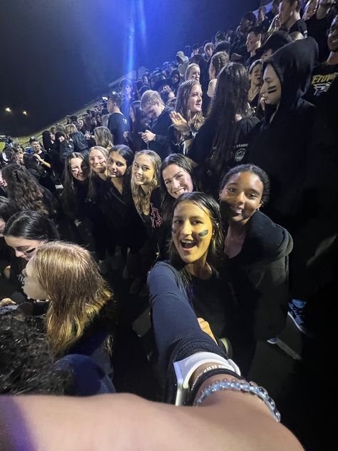 Teenagee girls take a .5 at a black out themed high school football game while it is raining Black Outfits Football Game, Black Out Fnl Theme, Black Out Outfits For Football Games, Black Out Fnl, Black Out Football Game Outfits, Blackout Football Game, Black Out Football Game, Highschool Vibes, Football Game Outfit Fall