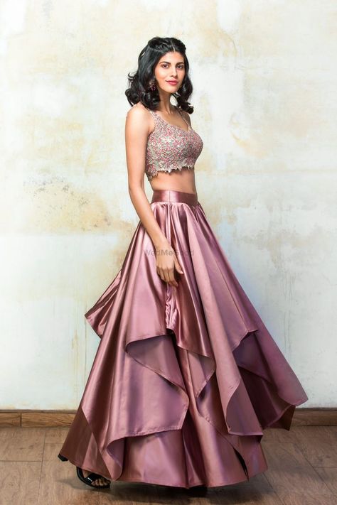 Rose pink satin layered lehenga by Izzumi Mehta Satin Lehenga Party Wear, Satin Dresses Indian Wear, Satin Layered Dress, Pink Satin Lehenga, Satin Dresses Traditional, Lehanga Designs Satin, Layered Lehenga Indian Outfits, Satin Traditional Outfit, Satin Traditional Dress