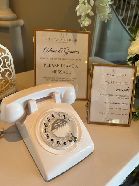 A white rotary telephone used as an audio guestbook at a wedding with two photo frames with instructions on how to use the guestbook. Voice Mail Wedding Guest Book, Wedding Telephone Guest Book, Telephone Wedding Guest Book, Wedding Voicemail, Audio Guest Book Table, No Phones Wedding, Wedding Telephone, Wedding Seating Chart Display, Wedding Phone