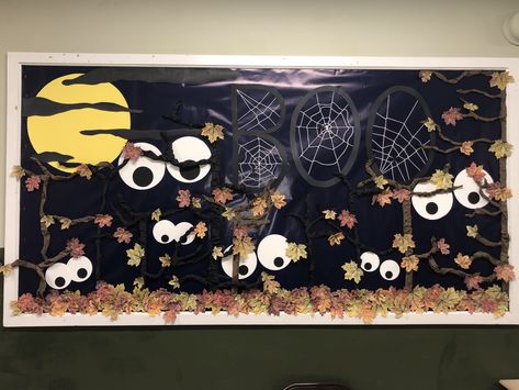 For our October bulletin board I went with a spooky forest to say, ‘Look out - fall is here!’  I love the mix of the fall leaves with eerie trees and lurking eyes.  Happy Halloween! #bulletinboards #october #pta Spooky Halloween Bulletin Boards, Happy Halloween Bulletin Boards, October Middle School Bulletin Boards, Halloween Bulletin Boards For High School, Halloween School Bulletin Board Ideas, Bulliten Board Ideas Fall, Halloween Bulletin Board Ideas Toddlers, Retro Fall Bulletin Board, October Bulletin Boards Elementary