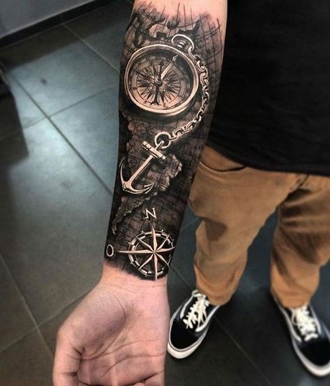 World map, compass and anchor tattoo on the arm done by @duartetattoo | www.otziapp.com Compass Forearm Tattoo, Natur Tattoo Arm, Nautical Tattoo Sleeve, Family First Tattoo, Black And Grey Realism, Compass Tattoo Design, Circle Tattoos, Map Tattoos, Forarm Tattoos