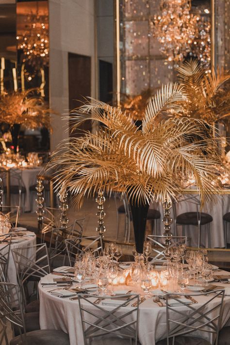 1920 Floral Arrangements, Golden Centerpieces, 1920 Shanghai, Palm Leaf Centerpiece, Black And Gold Centerpieces, Gala Centerpieces, Calla Lily Centerpieces, Art Deco Centerpiece, Gold Palm Leaves