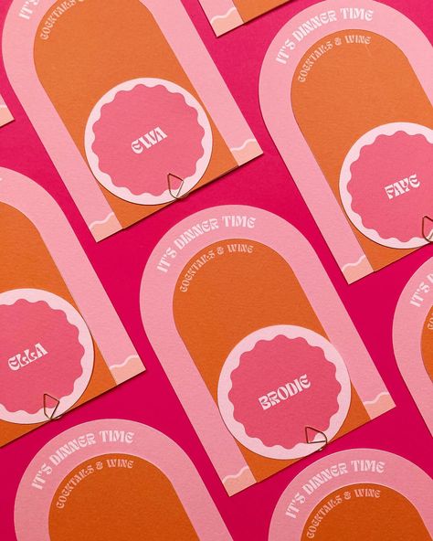 Another peek at the new suite in the house collection: It’s called Cuddles In The Kitchen, and these menu and placecard stacks are off to be part of a colourful shoot. Can’t wait to see them in situ in a pretty tablescape 🧡 ___ Image is of arched dinner menus, with a smaller arch wine and cocktail menu and a circle placecard held together with a gold clip. The font is funky and the colours are deep orange and various dusty pinks. • • • #weddingmenu #weddingcocktails #cocktailhour #weddingta... Orange And Pink Table Decor, Cuddles In The Kitchen, Galentines Brunch, Pink Table Decorations, Midsummer Wedding, 21 Dinner, Orange Cocktails, Wedding Name Cards, Pink Cocktails