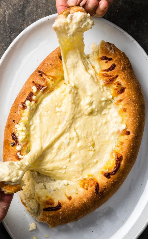 Adjaruli Khachapuri: Crusty bread filled with gooey cheese? Sounds like a party to us. Adjaruli Khachapuri, Khachapuri Recipe, Simple Pizza Dough, Simple Pizza, Georgia Food, Cooks Country Recipes, Donut Toppings, Georgian Food, Easy Pizza Dough