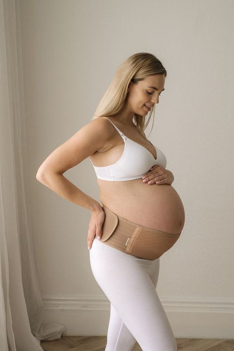 Pregnant woman wearing the Ease Maternity Support Belt, designed to relieve back and pelvic pain during pregnancy Maternity Belly Band, Pregnancy Belly Band, Pregnancy Belly, Maternity Belt, Belly Support, Growing Belly, Pelvic Pain, Pregnant Belly, Stay Active