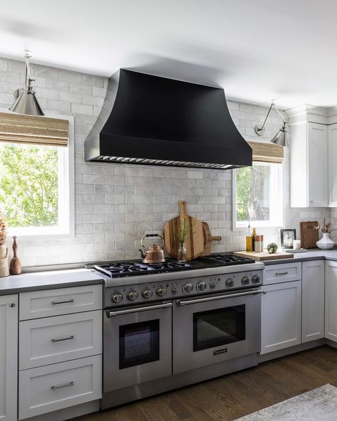 The kitchen was just fine, but when the stainless hood vent stopped working, we had the opportunity to rethink some things. I worked with Hoodsly and designed a custom wood hood that has a simple curved shape in a black painted finish. It is both minimalistic and bold, simultaneously. And with tons of natural light coming from new picture windows, we now have the perfect balance of dark and light. #edcShiftingGears After photos by @yandbinteriorsphotography #kitchenbeforeandafter #kitche... Hood Fans, Wood Hood, Hood Vent, Kitchen Hoods, Black Hood, Vent Hood, Prep Kitchen, New Picture, Picture Windows