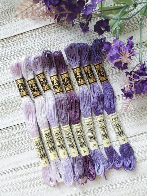 ❤ PRODUCT DETAILS ❤ DMC Set of Flosses- 8 Skeins DMC Art. 117 8 cotton skeins to inspire your next project.  Each skein measures (8m/8.7yds each) Made in France  IF WE ARE MISSING 1 SKEIN FROM THE ABOVE LIST WE WILL SEND THE CLOSEST COLOR. IF MORE THAN 1 IS MISSING YOU WILL BE CONTACTED Colors included:  25 White Lavender  26 Pale  Lavender 27 White Violet  28 Medium Eggplant 29 Eggplant 30 Medium Light Blueberry  31 Blueberry  32 Dark Blueberry  IF WE ARE MISSING 1 SKEIN FROM THE ABOVE LIST WE Dmc Floss Palette, Dmc Colour Palettes, Dmc Color Palette Embroidery, Dmc Green Palette, Dmc Floss Chart, Dmc Purple Palette, Cross Stitch Floss, Making Friendship Bracelets, Bead Tips