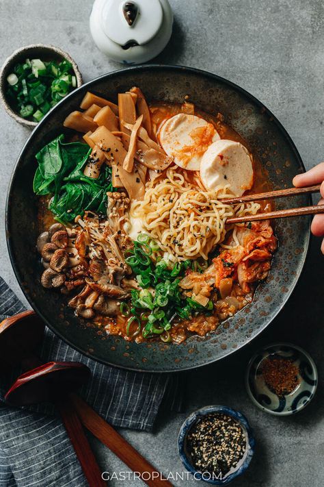 Vegan Kimchi Ramen combines things I love about both Korean instant noodles and Japanese restaurant-style ramen. It has an addictive spicy-umami broth, mushrooms, fermented bamboo shoots, and seaweed, with a touch of vegan butter on top. It’s just fun to eat, and it’s not hard to make. Mushroom Broth Ramen, Vegan Kimchi Ramen, Mushroom Miso Ramen, Korean Instant Noodles, Shitake Miso Ramen, Kimchi Ramen, Kimchi Noodles, Mushroom Ramen, Ramen Toppings