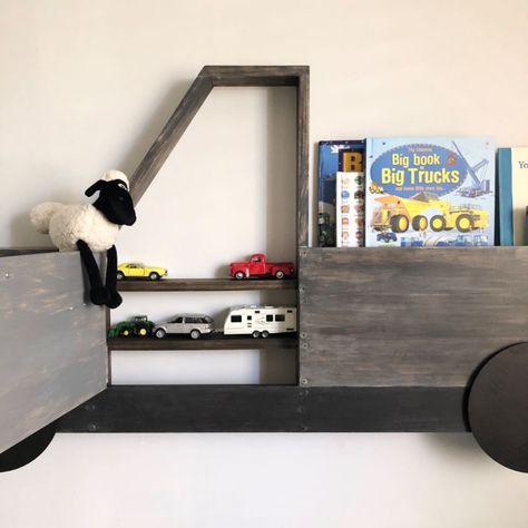 For my sons 3rd birthday I wanted to make him a bookshelf, something super cool that would double as a storage for his favourite toy cars.After some brainstorming, I decided on a Ute (as we call them in Australia) or truck structure, with a door that would open to storage and then a shelf in the back tray to hold his books. 🤩   I drew up a design and then measured out the space where I wanted it in my sons room to work out what size to make the structure. With the measurements and… Truck Shelf, Round Wall Shelves, Bookshelf Diy, Under Cabinet Lighting Wireless, Sons Room, Baby Toy Storage, Key Holder Diy, White Wall Paint, Boys Diy