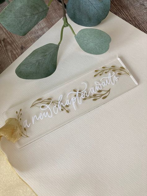 Bookmarks, Clear Acrylic Bookmarks, Book Lover, A new chapter awaits, Bookmark Diy Acrylic Bookmark Ideas, Diy Acrylic Bookmark, Bookmark Cricut, Acrylic Bookmark Ideas, Ribbon Calligraphy, Bookmarks Acrylic, Acrylic Bookmarks, Cricut Gifts, Cricut Business