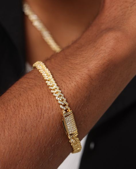 Level up your fit with high-class accessories from Saint Morta. Made with 18k gold plating and all-over round-cut brilliant stones, for a stand out look. The box clasp closure and a 6mm prong-style Cuban link are sure to make this last. A wide variety of sizes are available so you can style this however you like. Be sure to get yours today at Culture Kings. - 6mm prong style Cuban link - 18k gold plating - All over round cut brilliant stones - Box clasp closure - Length: - Size 7 = 7" - Size 7.5 = 7.5" - Size 8 = 8" - Size 8.5 = 8.5" - Size 9 = 9" - Approx. Weight: 22g - Colour: Iced Gold - Style: SMBB6MMICECUBPROBRA Cuban Bracelet: The Cuban bracelet is a classic flat link chain. This timeless piece is an all-time favourite, always in season, and never goes out of style. Featuring loose, Gold Cuban Link Bracelet, Gold Cuban Link Chain, Cuban Bracelet, Box Clasp, Mens Accessories Jewelry, Cuban Link Chain, Culture Kings, Cuban Chain, Cuban Link