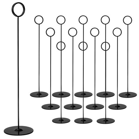 PRICES MAY VARY. Value Pack - Package includes 12 pieces metal table number holders. Color: Black. Unit Size: 12" H x 2.75" base dia. x 1.3" clip dia. Solid and sturdy display stands for centerpieces, food signs, memo notes, wedding table settings and decorations. High Quality Place Card Holder - Tosnail number stands are made of quality steel plated with black color, giving card stands a smooth, shining appearance. Solid and sturdy steel base makes it suitable for outdoor table setting. Versati Creative Table Number Holders, Tall Table Numbers, Table Sign Holder, Reserved Table Sign, Reserved Table Signs, Nerd Wedding, Memory Table, Table Number Holders, Outdoor Table Settings