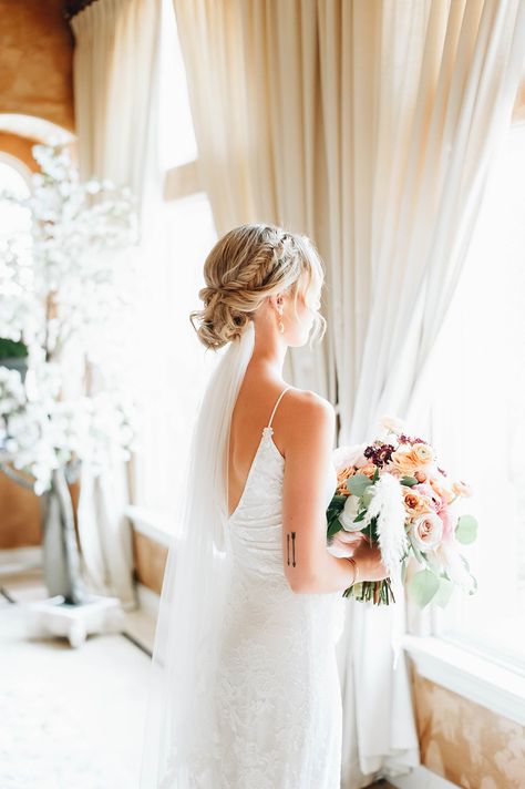 Veil Hair Updo Brides, Boho Wedding Updo With Veil, Wedding Hair Updo Veil Under, Low Bun Wedding Hair With Veil Under, Wedding Veil Below Bun, Veil Over Or Under Bun, Wedding Hair For Bride Updo Veils, Bride Updo With Veil Underneath, Wedding Hairstyles With Veil Braid