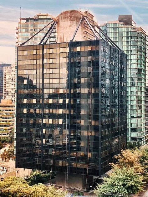 Vancouver’s only suspended building.  Opened in 1969 as the Westcoast Transmission Building, now converted to residential called Qube.  One of only a handful of such structures in the world, it is deemed to be Vancouver’s only earthquake-proof building.     I love this building and I wonder if it could be built today.     Is there a developer or company innovative and risk adverse enough to take such a chance and invest what must have been a considerable premium to build such a unique structure? Architecture History, Residential Building, Building Design, West Coast, Vancouver, Skyscraper, Google Images, Multi Story Building, Arch