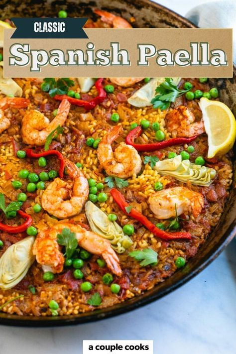 This Classic Spanish Paella Recipe made with saffron-scented rice, shrimp, and colorful vegetables. This stunning one-pan dinner is packed with authentic flavors! Find the recipe on our site. Best Paella Recipe, Spanish Paella Recipe, Vegetarian Paella, Rice Shrimp, Best Fish Recipes, A Couple Cooks, Winter Salad Recipes, Spanish Paella, Paella Recipe