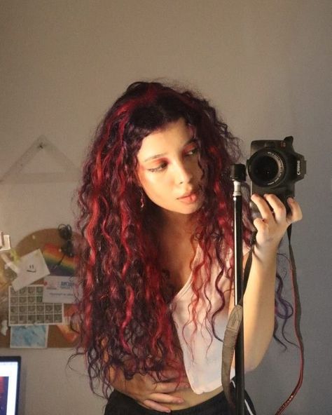 Scarlet Strands: The Best Red Highlight Looks Chunky Red Highlights Curly Hair, Curly Red Highlighted Hair, Curly Red Hair Highlights, Curly Hair Dyed Underneath Red, Hot Pink Highlights In Brown Hair Curly, Curly Hair With Streaks Of Color, Red Skunk Stripe Hair Curly, Ruby Red Curly Hair, Black Red Hair Curly