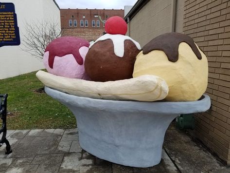 A larger-than-life statue of America's favorite sundae marks the place it was invented. Latrobe Pennsylvania, One Banana, Strawberry Sauce, Ice Cream Parlor, Banana Slice, Soda Fountain, Roadside Attractions, Classic Desserts, Maraschino Cherry