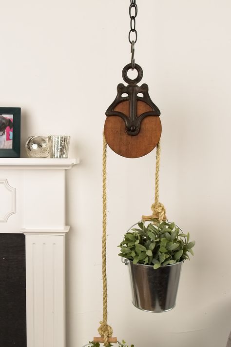 Get Familiar with Farmhouse - American Lifestyle Magazine Old Pully Ideas, Pulley Plant Hangers, Antique Pulley Plant Hanger, Pulley Decor Ideas, Pulley System For Hanging Plants, Wooden Pulley Ideas, Plant Pulley System, Old Tools Decor Ideas, Pulley Plant Hanger