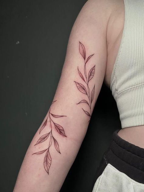 Women Vine Tattoo, Wrap Leaf Tattoo, Vine Tattoos Wrap Around Arm, Japanese Vine Tattoo, Bicep Vine Tattoo, Long Leaf Tattoo, Leaf Tattoo On Shoulder, Leaf Tattoo With Words, Leaf Vine Tattoo Shoulder