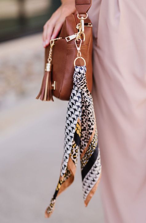 Pair the silky-soft Breanna Keychain with your keys or bag, or add the scarf to accessorize your hair. We love a multitasker. Details: 15” long Scarf Keychain, Scarf On Bag, Bag Accessories Keychain, Silk Scarf Outfit, Boho Keychain, Keychain Purse, Purse Scarf, Satin Scarf, School Jewelry