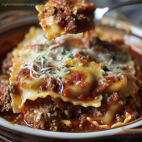 This Crockpot Ravioli Lasagna is a hearty and easy-to-make dish. Layered with cheese ravioli, ground beef, and rich pasta sauce, it's perfect for a satisfying family dinner. Easy Crockpot Ravioli Lasagna Recipe, Crockpot Cheese Ravioli Recipe, Crockpot Ravioli Lasagna Crock Pot, Lasagna Soup With Ravioli, Easy Crockpot Ravioli Lasagna, Ravioli Lasagna Soup, Beef Ravioli Recipe Frozen, Frozen Ravioli Recipes Crockpot, Ravioli Recipe Crockpot