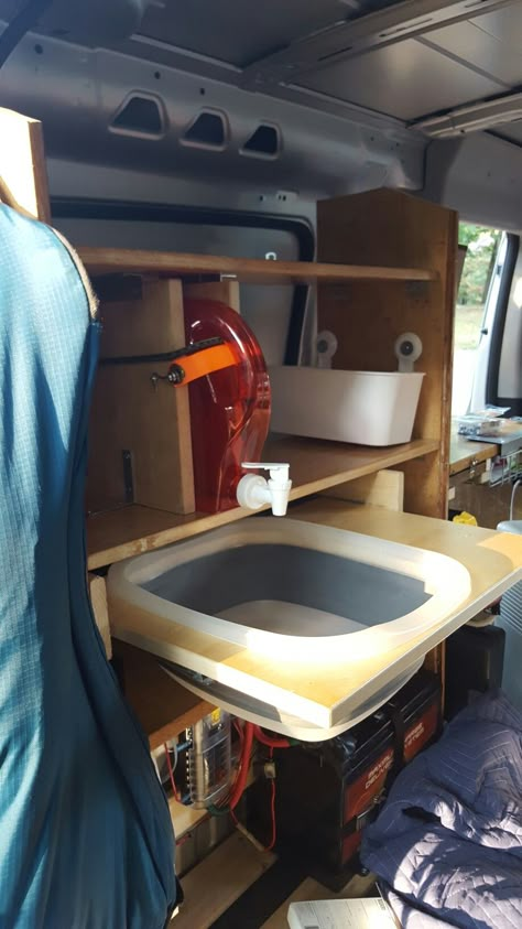 Simple collapsible sink on drawer tracks for van conversion. I've seen all sorts of pins for van conversions, and i thought i would add my 2 cents. I havent seen anyone else do this yet (doesn't mean it hasn't been done tho) i plan to add a drain that will empty out at the bottom of my van but this is what ive finished so far. Its simple and easy i just purchased a collapsible basin and cut out a hole in a peice of scrap counter top which i then mounted to drawer tracks. Van Drawers, Simple Van Conversion, Van Conversion Sink, Drawer Tracks, 1000 Lifehacks, Minivan Camping, Cargo Trailer Camper, Camper Kitchen, Van Storage