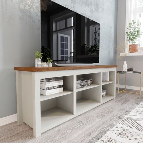 Simple lines and minimalist style abound in this TV stand for up to 80" TV's. Open concept storage and a cord management port are ideal for displaying the newest electronics and family mementos while keeping everything neat and tidy. Tv Storage, Simple Tv Console, Under Tv Storage, Homemade Tv Stand, Bookshelves With Tv, Farmhouse Tv, White Bookshelves, Farmhouse Tv Stand, Furniture Movers