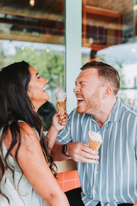 Couple laughing while holding their ice cream cones. Ice Cream Shop Photo Shoot Couple, Ice Cream Maternity Photoshoot, Engagement Photos With Ice Cream, Ice Cream Maternity Shoot, Ice Cream Date Photoshoot, Ice Cream Couple Photoshoot, Ice Cream Parlor Photoshoot, Coronado Photoshoot, Unique Prenup Photoshoot Ideas