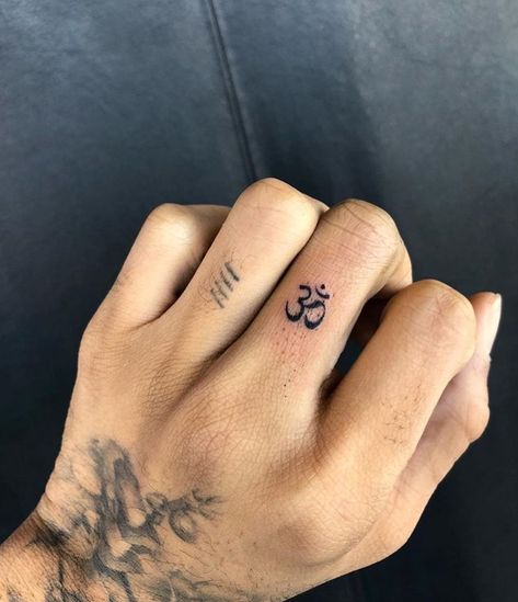 OM Tattoo 🕉 hand tattoo, finger tattoo Om Tattoo Designs, Om Symbol Tattoo, Luck Tattoo, Om Tattoo Design, Finger Tattoo For Women, Finger Tats, Om Tattoo, Hand Tattoos For Women, Spiritual Tattoos