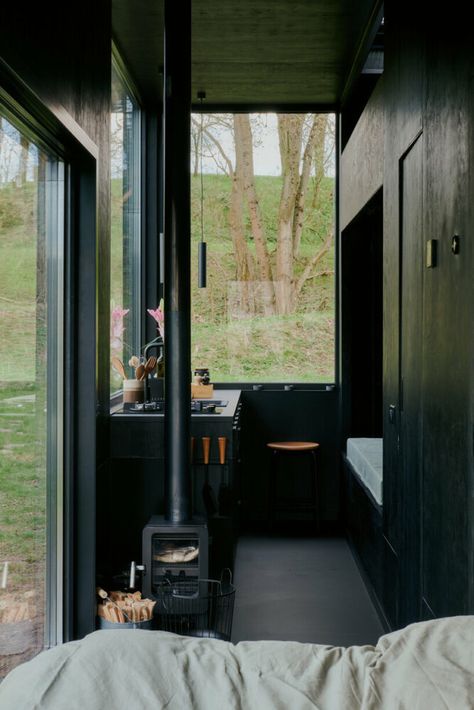 sigurd larsen makes nature the protagonist with muted black cabin retreat Boutique Hotel Room, Black Cabin, Rural Retreats, Tiny Cabin, Big Windows, House Roof, Cabin Design, Cabins In The Woods, Off The Grid