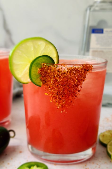 Close-up picture of a watermelon margarita with a tajin rim Tajin Rim Margarita, Cocktails With Tajin, Margarita With Tajin Rim, Tajin Recipes Drink, Tajin Rimmed Drinks, Drinks With Tajin Rim, Tajin Cocktails, Tajin Margarita, Watermelon Tajin