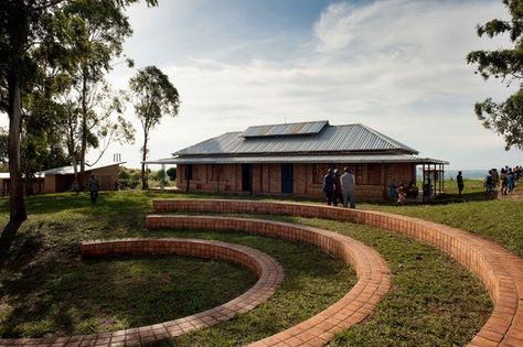 © Will Boase Modern Spanish Interior Design, Spanish Interior Design, Screed Floors, Village School, Spanish Interior, School Building Design, Window Shutters, School Building, Brick Building