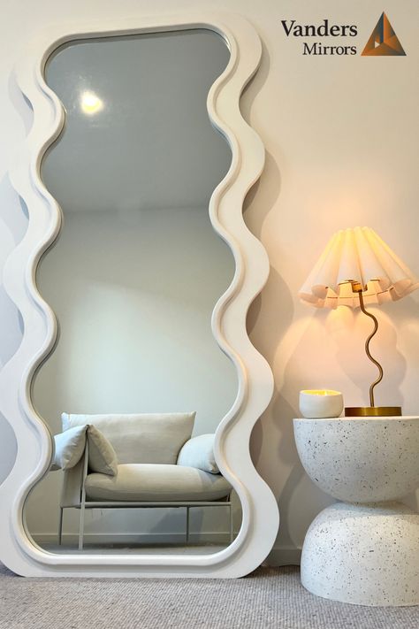 Wavy mirrors, curved mirrors or odd shaped mirrors are taking over and doubling as art within the home. These mirrors create a unique but calming environment in your home and are a must have piece in 2023. #mirror #wavymirror #curvedmirror #bathroomreno #bedroomreno #fashion #salon #hairsalon #aesthetic # Squiggly Mirror, Aesthetic Corner, Curvy Mirror, Curved Mirror, Wavy Mirror, Mirror Inspiration, Scandinavian Aesthetic, Style Deco, Studio Ideas