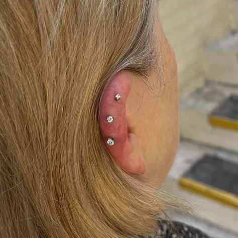 Rogue Piercing on Instagram: "This has been quite the fun project! @gempiercing_ started this triple vertical helix set for Sarah, each piercing adorned with @neometaljewelry Prongs to commemorate her three grandchildren. This week @jestrums_eve had the honour of adding the lowest one to complete the trilogy. Thank you Sarah for your trust on these ones! They are absolutely beautiful. #earpiercing #curatedear #piercings #cartilagepiercing #conchpiercing #helixpiercing #nosepiercing #septu Vertical Helix Piercing, Philtrum Piercing, Bridge Piercing, Ear Chain, Navel Piercing, Conch Piercing, Lip Piercing, Septum Piercing, Helix Piercing