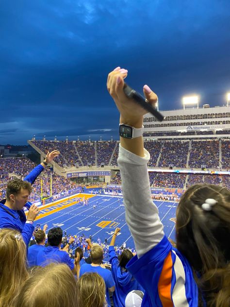 Boise State’s signature blue turf field shot from the student section stands with students cheering and celebrating together. Boise State Aesthetic, Boise State University Aesthetic, Boise Aesthetic, College Aesthetic Pictures, Future Manifestation, Boise State Football, Idaho State University, University Aesthetic, College Pictures